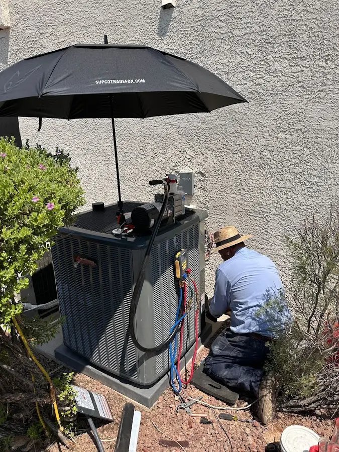HVAC technician performing outdoor AC maintenance in Temple